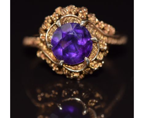 A 9ct gold ring set with a round cut amethyst, 4g, size O