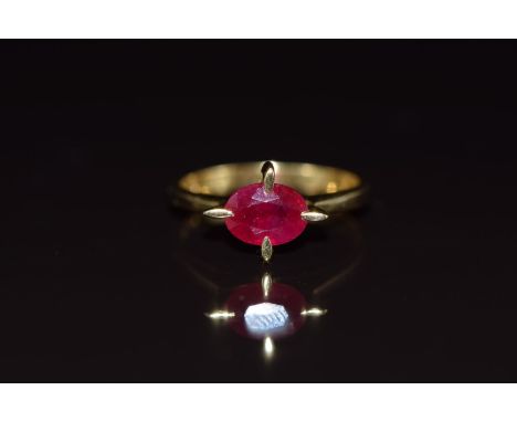 An 18ct gold ring set with an oval cut ruby of approximately 1.5ct, 3.7g, size M/N