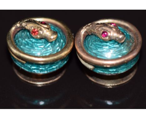 Two Victorian studs set with turquoise guilloché enamel with gold serpents set with ruby eyes, 2.9g&nbsp;