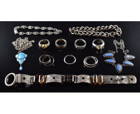 A collection of silver jewellery including six rings, silver and 14k gold ring, Victorian bracelet set with agate, curb link 