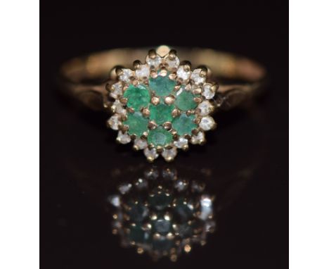 A 9ct gold ring set with emeralds and diamonds in a cluster, 1.8g, size Q