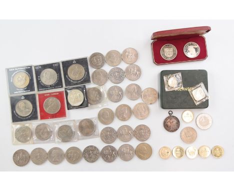 Over thirty commemorative crowns, 1953 onwards, contained in a late Victorian tea caddy, together with a cased pair of 1966 R