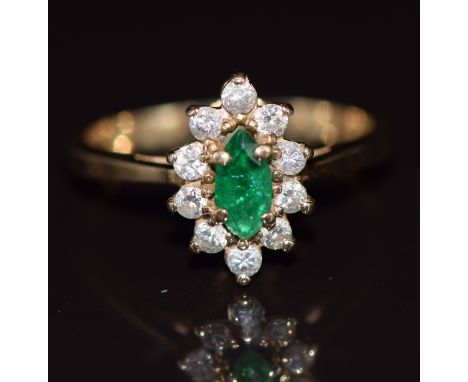 A 14k gold ring set with a marquise cut emerald surrounded by diamonds, 3.0g, size M