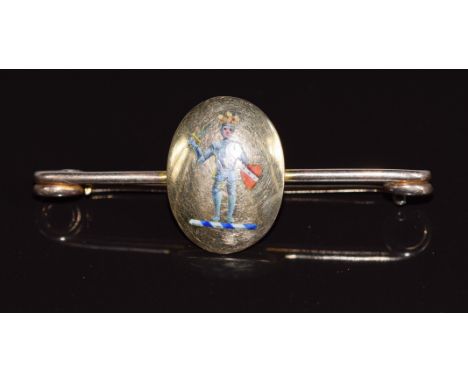 An 18ct &amp; 9ct gold brooch set with enamel depicting a soldier, maker M &amp; M, 5.3g