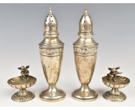 Pair of novelty silver salts by shell shaped bowls surmounted with cherubs, together with a pair of peppers, all items marked