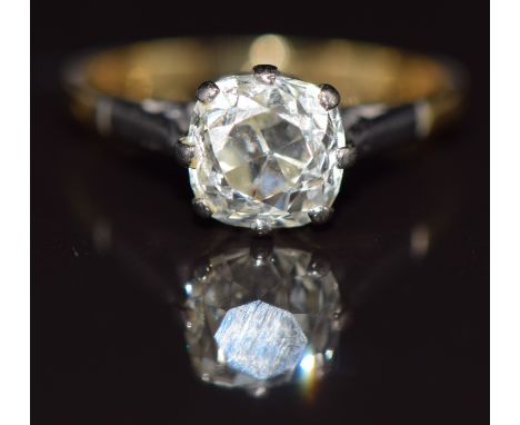 A c1920 18ct gold ring set with an old cushion cut diamond of approximately 1.2ct in a platinum setting, size J, 2.5g&nbsp;