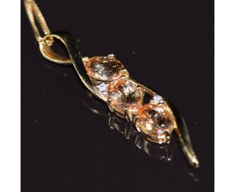 A 9k gold pendant set with topaz and diamonds, on 9k gold chain, length 36cm, 5.5g all in