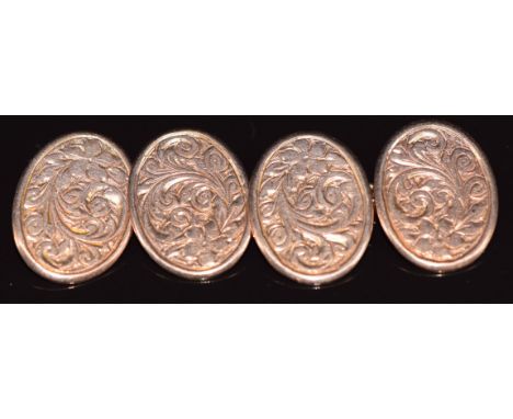 A pair of Edwardian 9ct rose gold cufflinks with scrolling decoration, Birmingham 1908, 7.7g