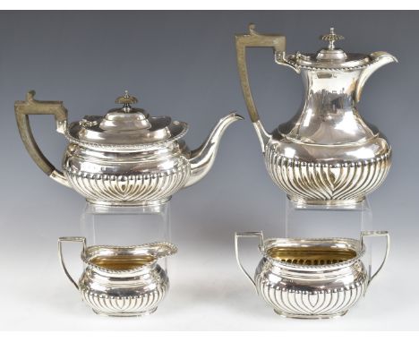 Elkington &amp; Co Ltd, George V hallmarked silver four piece teaset with gadrooned edges and reeded lower bodies, teapot, mi