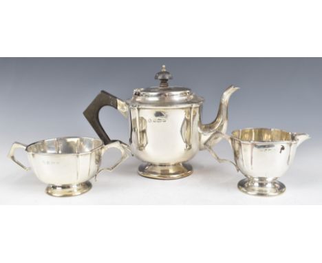 George V hallmarked silver three piece bachelor's teaset with Arts and Crafts or Art Nouveau decoration, Birmingham 1920, mak