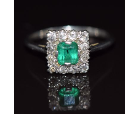 Belle Epoque platinum ring set with an emerald cut emerald of approximately 0.5ct surrounded by diamonds, 3.7g, size O