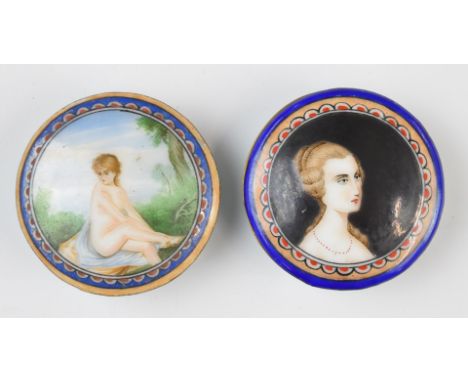 Two enamelled pill boxes, one depicting a nude lady, diameter 6cm