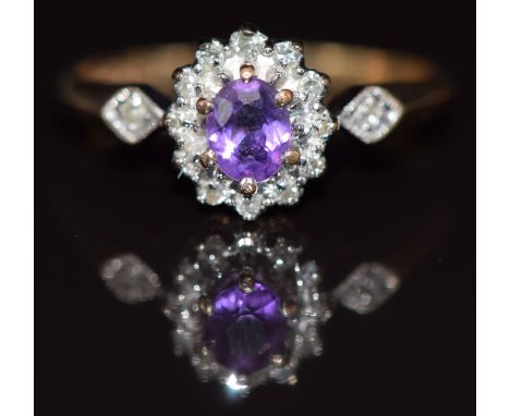 A 9ct gold ring set with an amethyst and diamonds, 1.9g, size N