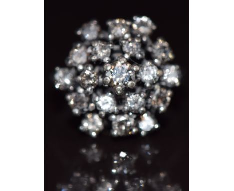 A 14k white gold ring set with diamonds in a cluster, the centre diamond approximately 0.22ct, total diamond weight approxima