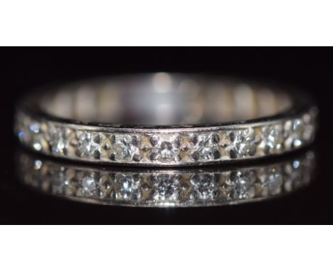 Art Deco platinum eternity ring set with twenty two round cut diamonds, each approximately 0.03ct, 3.5g, size R