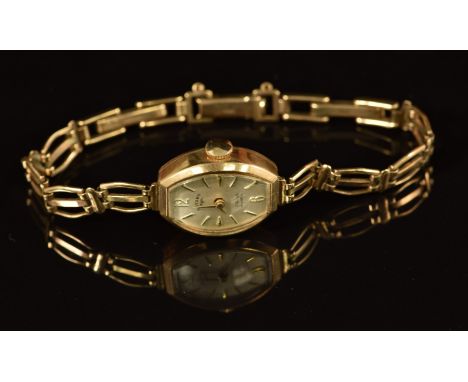 Rotary 9ct gold ladies wristwatch with gold hands and hour markers, silver dial and 17 jewel movement, on 9ct gold bracelet, 
