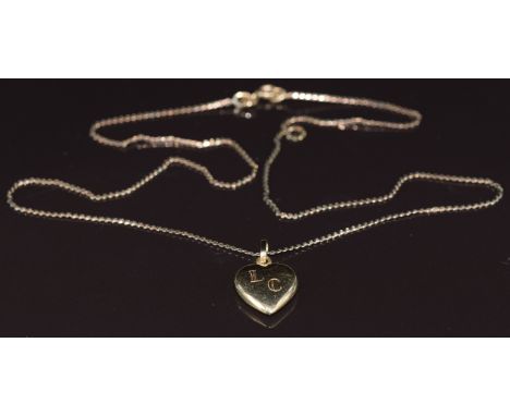 A 14k gold heart pendant (1.4g) on 9ct gold chain, 2.1g