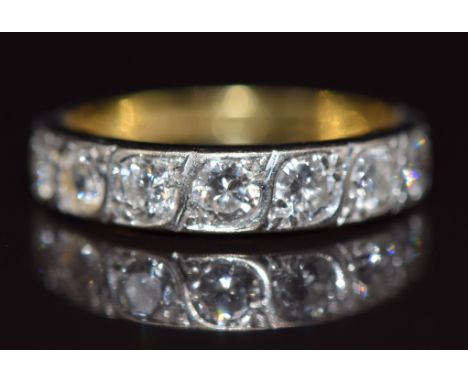 An 18ct gold half eternity ring set with seven diamonds, each approximately 0.13ct, 3.1g, size M