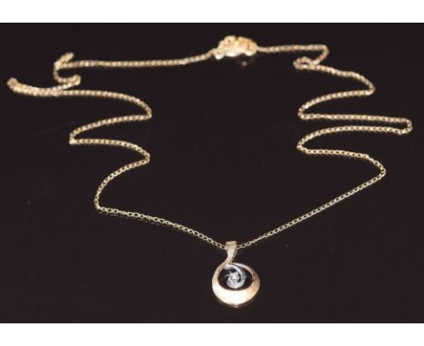 A 14k gold bi-coloured pendant set with a diamond, on 14k gold chain, 1.3g&nbsp;