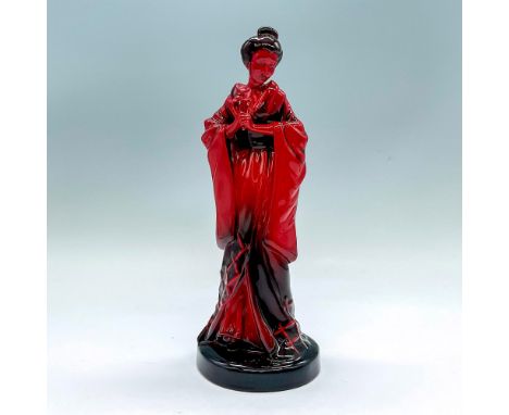 Glazed figure of a lady in a long robe style dress with an obi sash at her waist holding a fan. Red withÂ&nbsp;black accents.