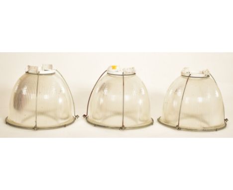 Holophane - A set of three retro mid 20th century industrial factory pendant light shades of metal and glass construction hav