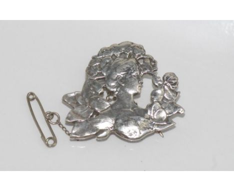 Art Nouveau brooch of girl with flowers size: approx 3.5 by 3 cm