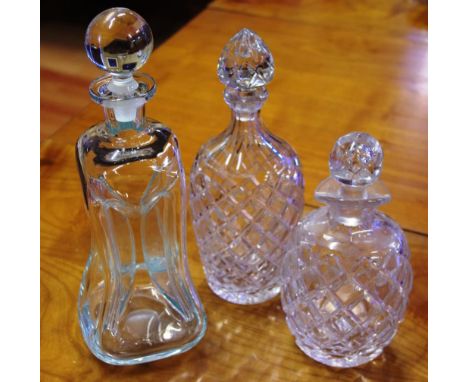 Three vintage glass decanters to include 2 crystal decanters, and a Holmegaard glug glug decanter