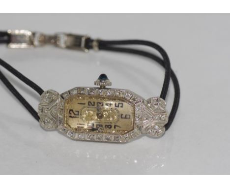 Art deco platinum ladies watch set with diamonds chord strap with 14ct gold fastener, made by Zador  total weight: approx 12.