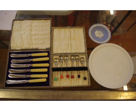 Cased set of silver plated tea knives and a set of plated, together with a ceramic plaque and dish