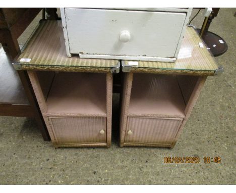 PAIR OF LLOYD LOOM TYPE PINK WICKER BEDSIDE CUPBOARDS WITH OPEN SHELF AND SINGLE CUPBOARD DOOR