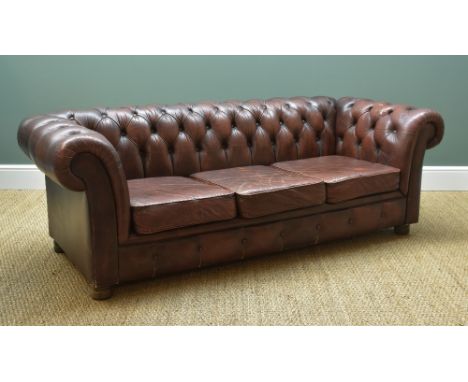 20TH CENTURY BROWN LEATHER CHESTERFIELD SOFA, with three loose cushions, 202cms wide, &amp; an Ottoman footstool (2) Comment: