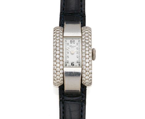   CHOPARD CHOPARD  La Strada. Schweiz. Um 1990.   Quarz. 750/- Weißgold, diamantgeziert, Orig.-Lederband mit Orig.-Dornschlie