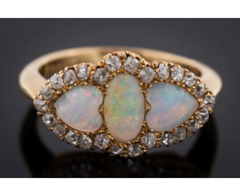 An opal and diamond cluster ring: with central oval opal between heart shaped opals, within a surround of square cut and sing