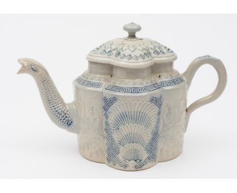 A Staffordshire saltglazed stoneware teapot and cover: of quatrefoil form with serpent spout, relief moulded and heightened i