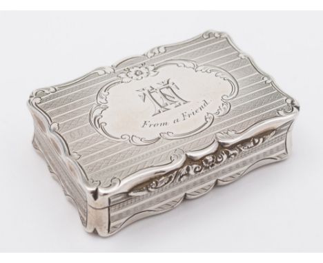 A Victorian silver snuff box, maker Aston & Sons, Birmingham, 1860: initialled and inscribed, of rectangular outline, with ge