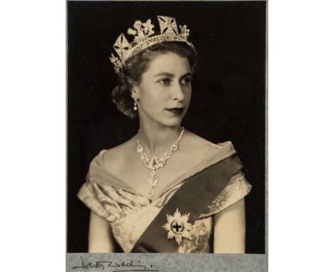 Dorothy Wilding [1893-1976]-
Queen Elizabeth II [1952]:-
silver print, signed in ink on the tissue mount bottom left
image sh