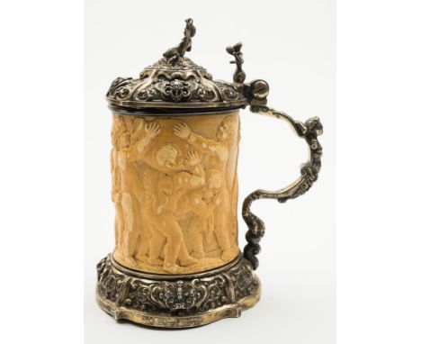 A 19th century Austrian ivory and silver mounted tankard, bears mark to the lid for 1857: the domed hinged lid with satyr fin