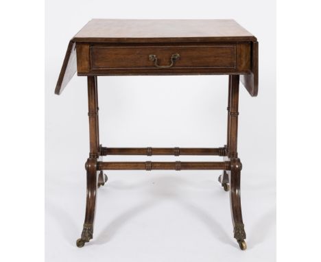 A Regency mahogany sofa table:, of small size, the hinged top with rounded corners, fitted with a frieze drawer on ring turne