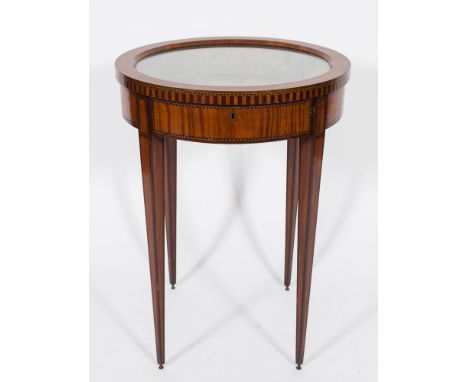 A late 19th Century Continental satinwood and inlaid circular bijouterie display table:, bordered with boxwood, ebonised and 