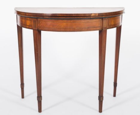 A 19th Century satinwood, tulipwood crossbanded and inlaid half round card table:, bordered with boxwood and ebony lines, hav