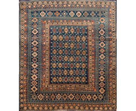 An Erivan rug:, the indigo rectangular panel field with hooked geometric medallions, enclosed by a main indigo cartouche pane