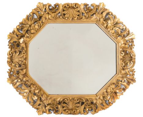 A 19th Century carved giltwood Florentine octagonal wall mirror:, the plate within an acanthus, scroll and palmette surround,