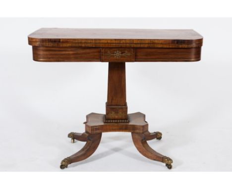 A Regency rosewood and brass inlaid rectangular card table:, bordered with lines and decorated with stylised foliate designs 