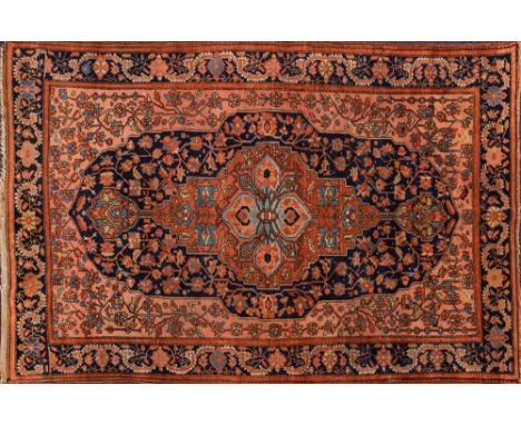 A Hamadan (Melayer) rug:, the field with a central pastel blue flowerhead and brick red pole medallion, indigo cartouche pane