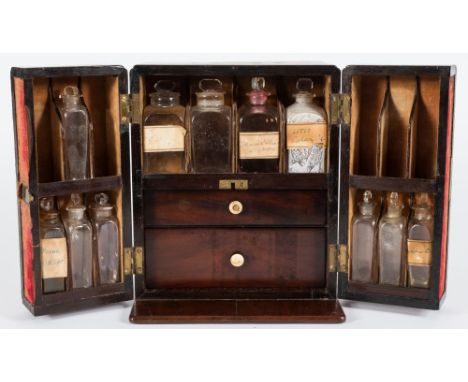 A 19th century mahogany apothecary's chest: of rectangular outline, with recessed brass handle to the top, the double hinged 