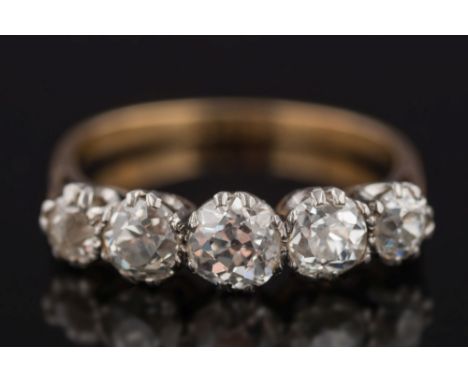 A gold and diamond five-stone half-hoop ring: with graduated round old brilliant-cut diamonds (one chipped) estimated to weig