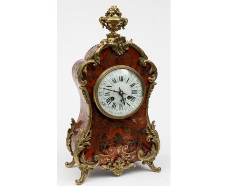 A French red boulle mantel clock: the eight-day duration movement striking the hours and half-hours on a gong, the backplate 