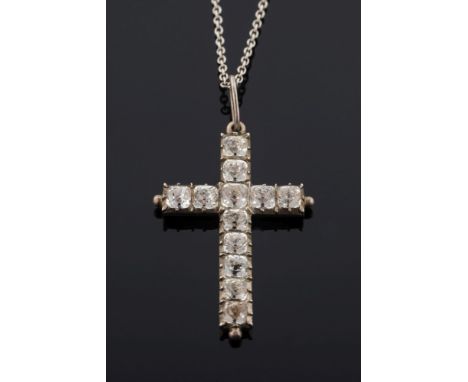 A mid 19th century silver and paste-set pendant cross: with cushion-shaped foil-backed paste in cut-down collet settings with