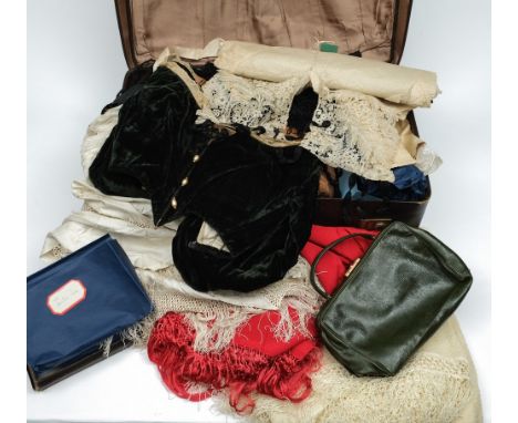 A Spanish lace mantilla: assorted lace edging, a Victorian black silk bodice, veil, two silk shawls, a green leather handbag 