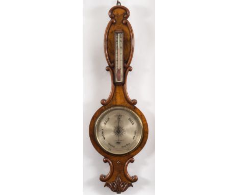 Callaghan, London, a walnut wheel barometer: the case with carved scroll mouldings and carved floral decoration to the base, 